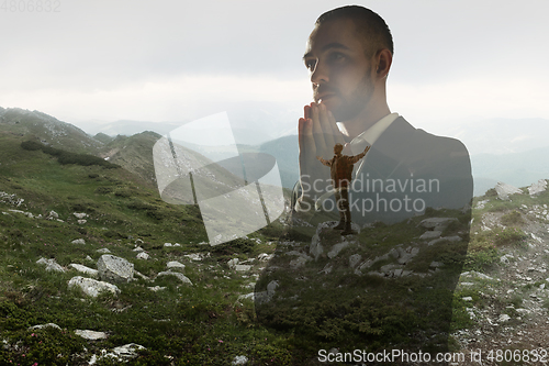 Image of Silhouette of businessman with landscapes on background, double exposure.