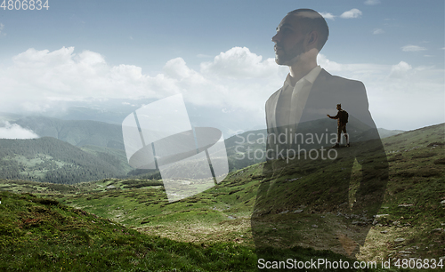 Image of Silhouette of businessman with landscapes on background, double exposure.