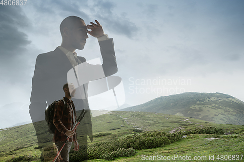 Image of Silhouette of businessman with landscapes on background, double exposure.