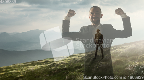 Image of Silhouette of businessman with landscapes on background, double exposure.