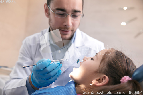 Image of Young caucasian girl visiting dentist\'s office