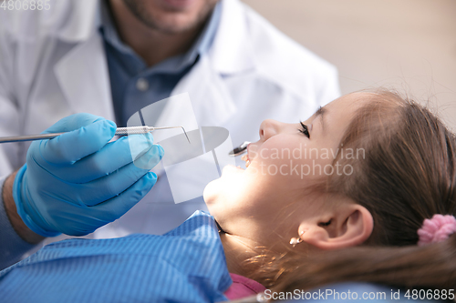 Image of Young caucasian girl visiting dentist\'s office