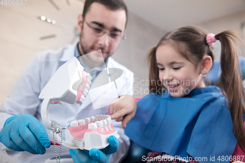 Image of Young caucasian girl visiting dentist\'s office