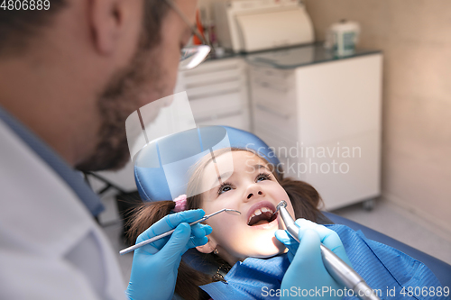 Image of Young caucasian girl visiting dentist\'s office