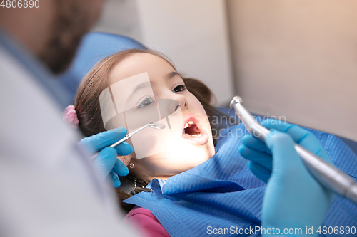 Image of Young caucasian girl visiting dentist\'s office