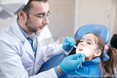 Image of Young caucasian girl visiting dentist\'s office