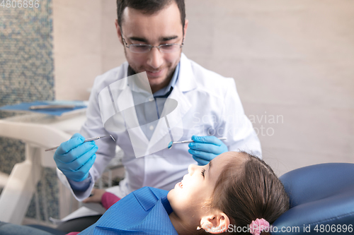 Image of Young caucasian girl visiting dentist\'s office