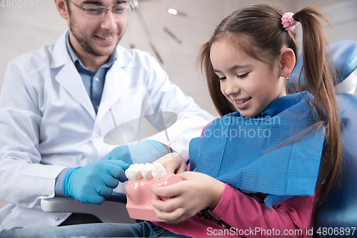 Image of Young caucasian girl visiting dentist\'s office