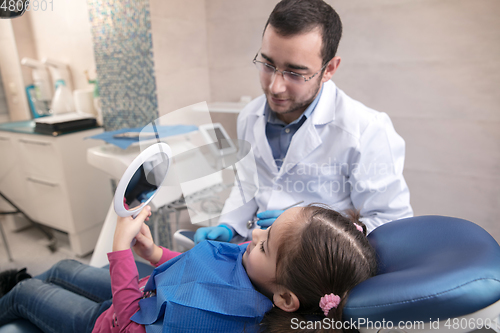 Image of Young caucasian girl visiting dentist\'s office