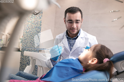 Image of Young caucasian girl visiting dentist\'s office