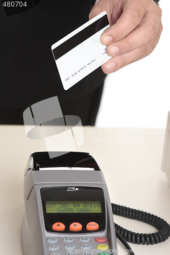 Image of Man paying with card