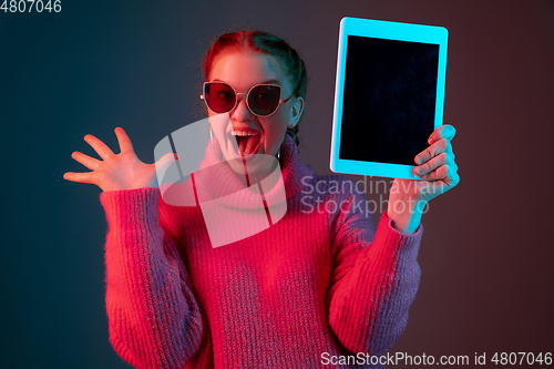 Image of Caucasian woman\'s portrait isolated on gradient studio background in neon light
