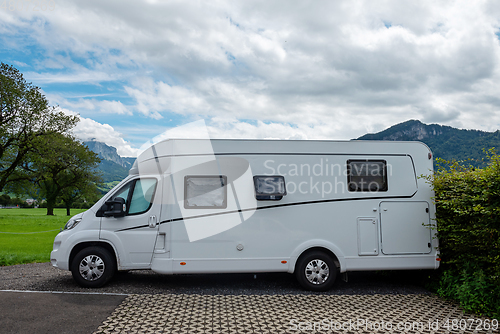 Image of Caravan car vacation. Family vacation travel RV. Holiday trip in motorhome. Switzerland natural landscape