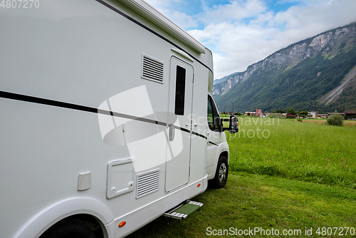 Image of Caravan car vacation. Family vacation travel RV. Holiday trip in motorhome. Switzerland natural landscape