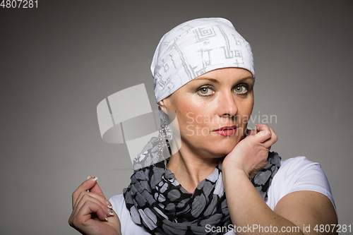 Image of beautiful woman cancer patient wearing headscarf