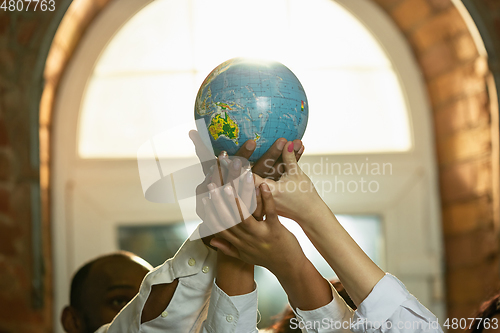 Image of Close up of african-american and caucasian human\'s hands gesturing