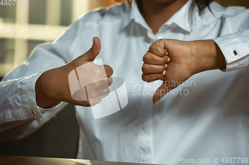 Image of Close up of african-american and caucasian human\'s hands gesturing