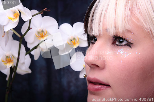 Image of Woman and orchid