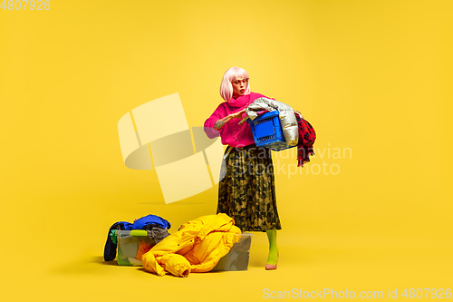 Image of Caucasian woman\'s portrait isolated on yellow studio background, influencer be like