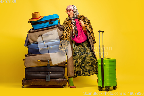 Image of Caucasian woman\'s portrait isolated on yellow studio background, influencer be like