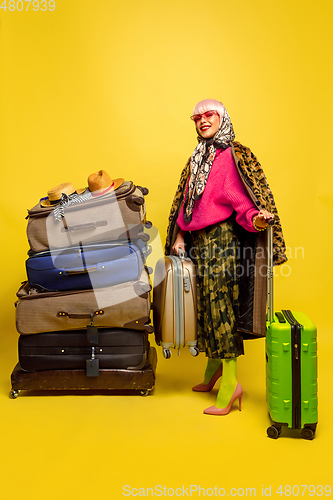 Image of Caucasian woman\'s portrait isolated on yellow studio background, influencer be like