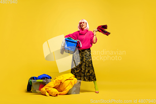 Image of Caucasian woman\'s portrait isolated on yellow studio background, influencer be like