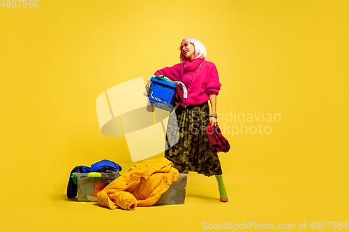 Image of Caucasian woman\'s portrait isolated on yellow studio background, influencer be like