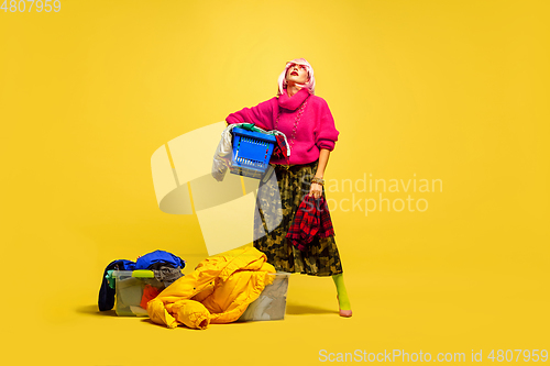 Image of Caucasian woman\'s portrait isolated on yellow studio background, influencer be like