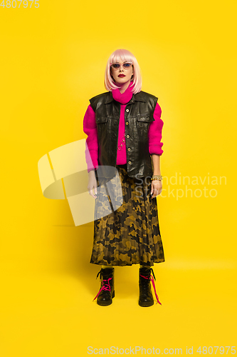 Image of Caucasian woman\'s portrait isolated on yellow studio background, influencer be like