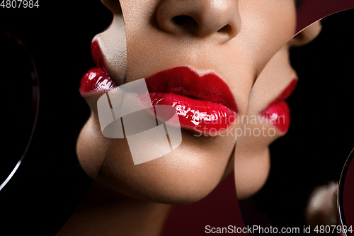 Image of beautiful woman lips closeup with mirror reflections