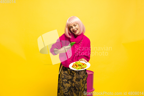 Image of Caucasian woman\'s portrait isolated on yellow studio background, influencer be like