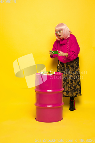 Image of Caucasian woman\'s portrait isolated on yellow studio background, influencer be like