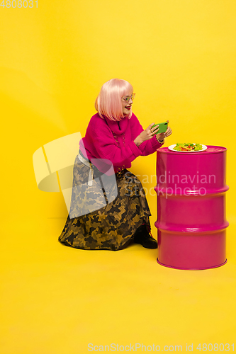 Image of Caucasian woman\'s portrait isolated on yellow studio background, influencer be like