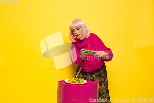 Image of Caucasian woman\'s portrait isolated on yellow studio background, influencer be like