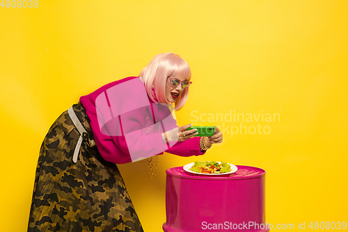 Image of Caucasian woman\'s portrait isolated on yellow studio background, influencer be like