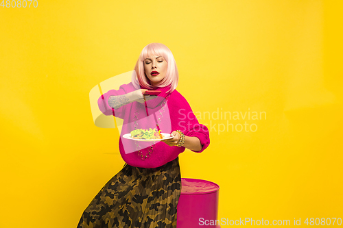 Image of Caucasian woman\'s portrait isolated on yellow studio background, influencer be like
