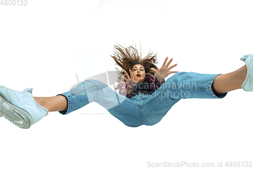 Image of A second before falling - young girl falling down with bright emotions and expression