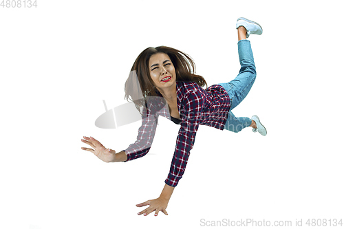 Image of A second before falling - young girl falling down with bright emotions and expression