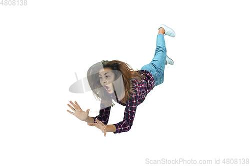 Image of A second before falling - young girl falling down with bright emotions and expression