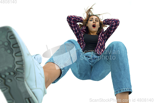Image of A second before falling - young girl falling down with bright emotions and expression