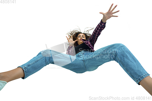 Image of A second before falling - young girl falling down with bright emotions and expression