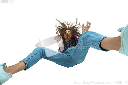 Image of A second before falling - young girl falling down with bright emotions and expression