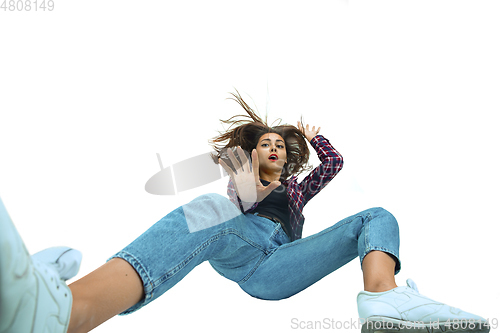 Image of A second before falling - young girl falling down with bright emotions and expression