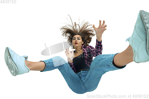 Image of A second before falling - young girl falling down with bright emotions and expression