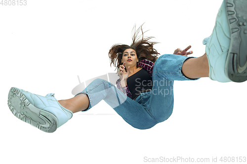 Image of A second before falling - young girl falling down with bright emotions and expression