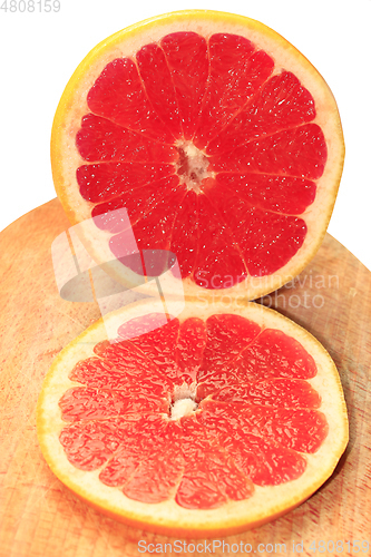 Image of pieces of grapefruit on the board isolated