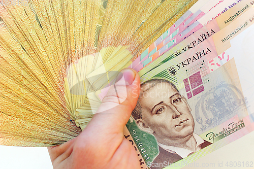 Image of Ukrainian money in the hand