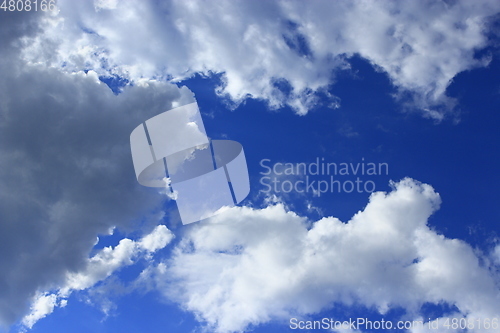 Image of white clouds on blue sky background