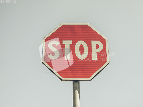 Image of Vintage looking Stop sign over blue sky