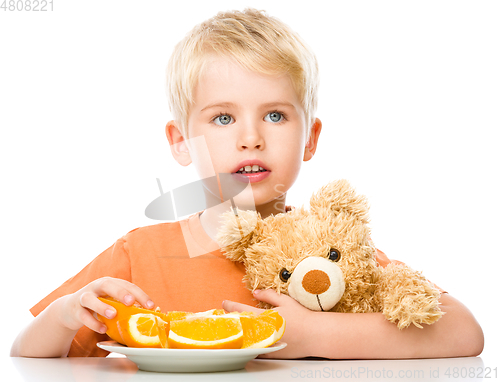 Image of Portrait of a little boy with his teddy bear